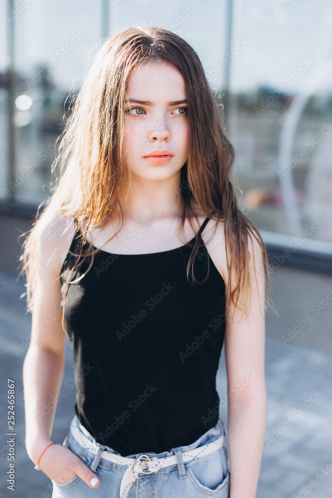 Portrait of caucasian sensual emotional teen depressed girl outdoors. Adolescence, urban, beauty concept Portrait of caucasian sensual emotional teen depressed girl outdoors. Adolescence, urban, beauty concept