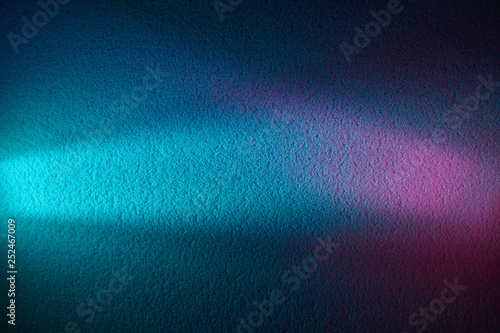 On a blue gradient background, a turquoise ray of light and a pink glow