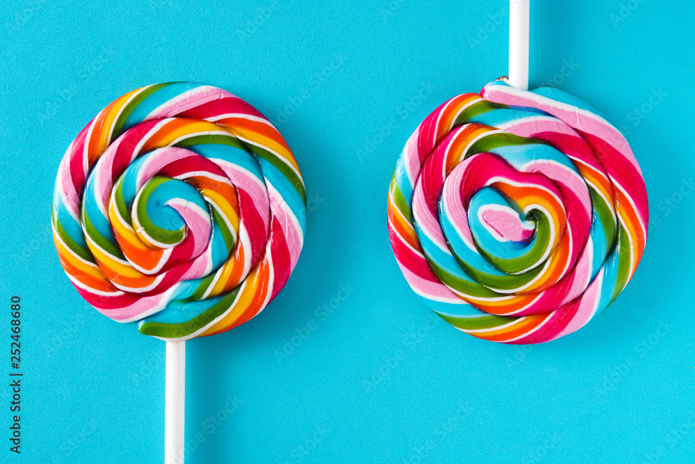 Colorful lollipops on blue background