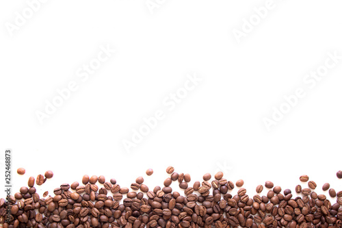 close up line of texture brown coffee beans isolated on white