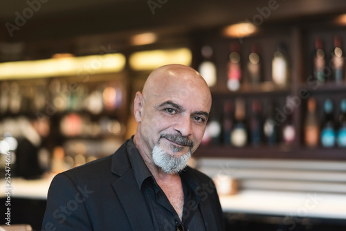 Mature man in a cafe enjoying a relaxing moment