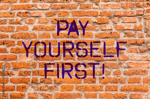 Conceptual hand writing showing Pay Yourself First. Business photo showcasing Personal Finance Save money for future Brick Wall art like Graffiti motivational written on wall