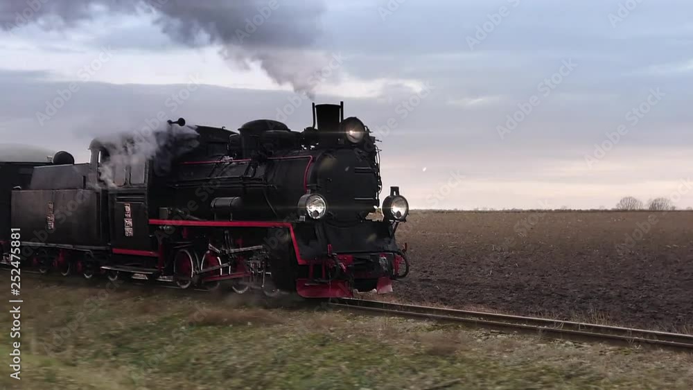 Old passangers train running on the tracks. Retro locomotive with steam engine loopable footage. Old passangers train running on the tracks. Retro locomotive with steam engine loopable footage.