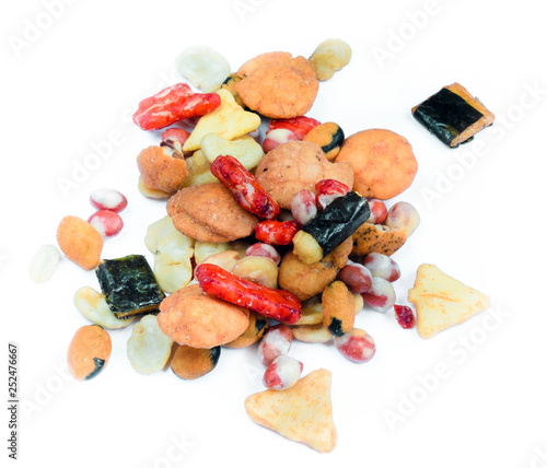 Mix of Japan snacks isolated on white background. Including tempura, nori maki, crackers in nori, close up.