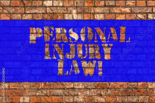 Writing note showing Personal Injury Law. Business photo showcasing guarantee your rights in case of hazards or risks Brick Wall art like Graffiti motivational call written on the wall