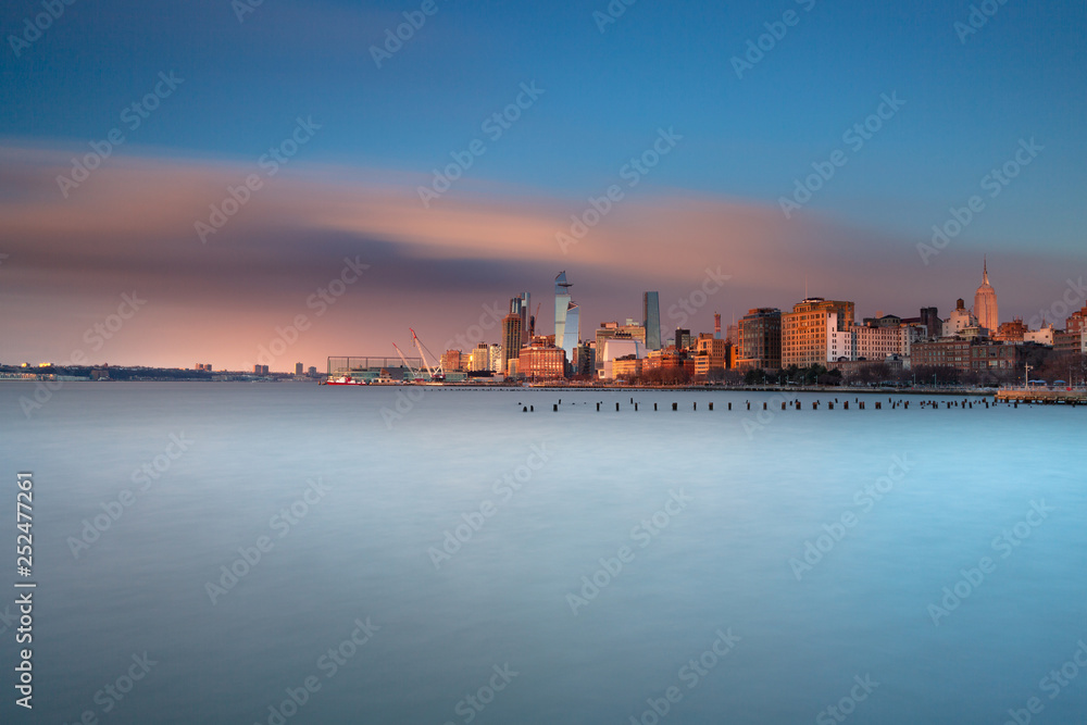 View on Midtown Manhattan from Hudson River at sunset with long exposure