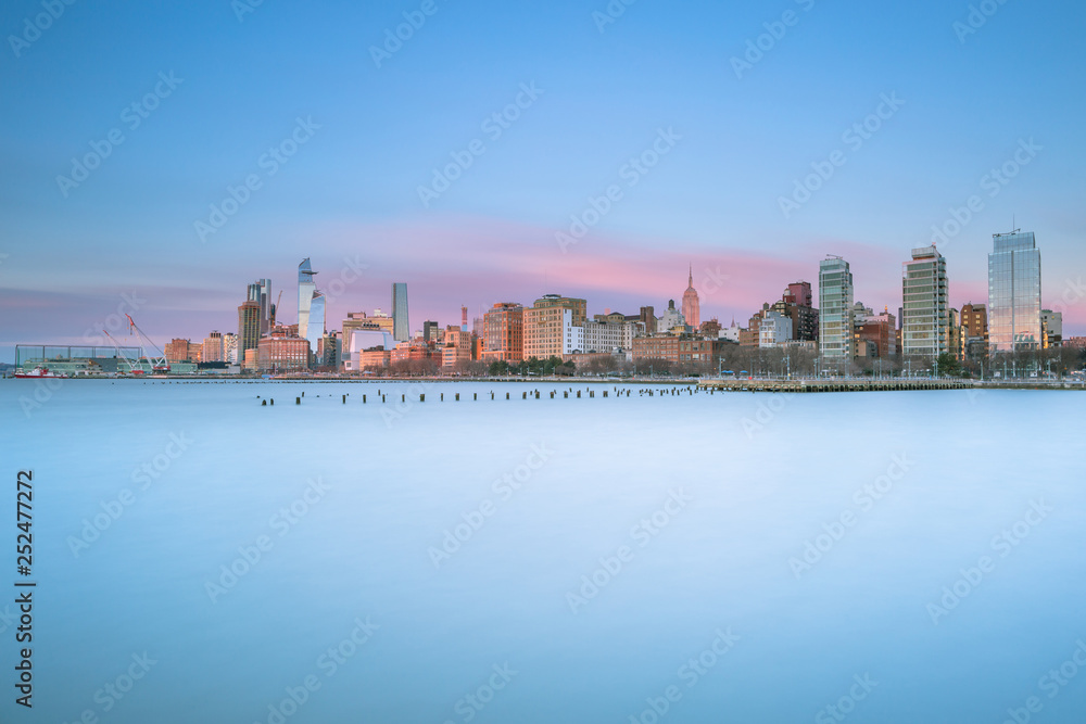 Midtown Manhattan from Hudson River at sunset with long exposure