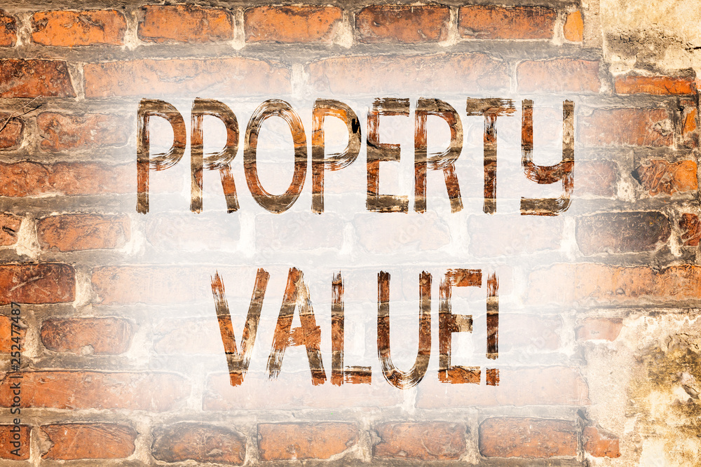 Writing note showing Property Value. Business photo showcasing Estimate of Worth Real Estate Residential Valuation Brick Wall art like Graffiti motivational call written on the wall