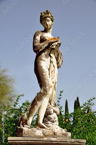 statue of woman in garden