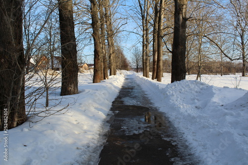 track with ice and puddles in early spring