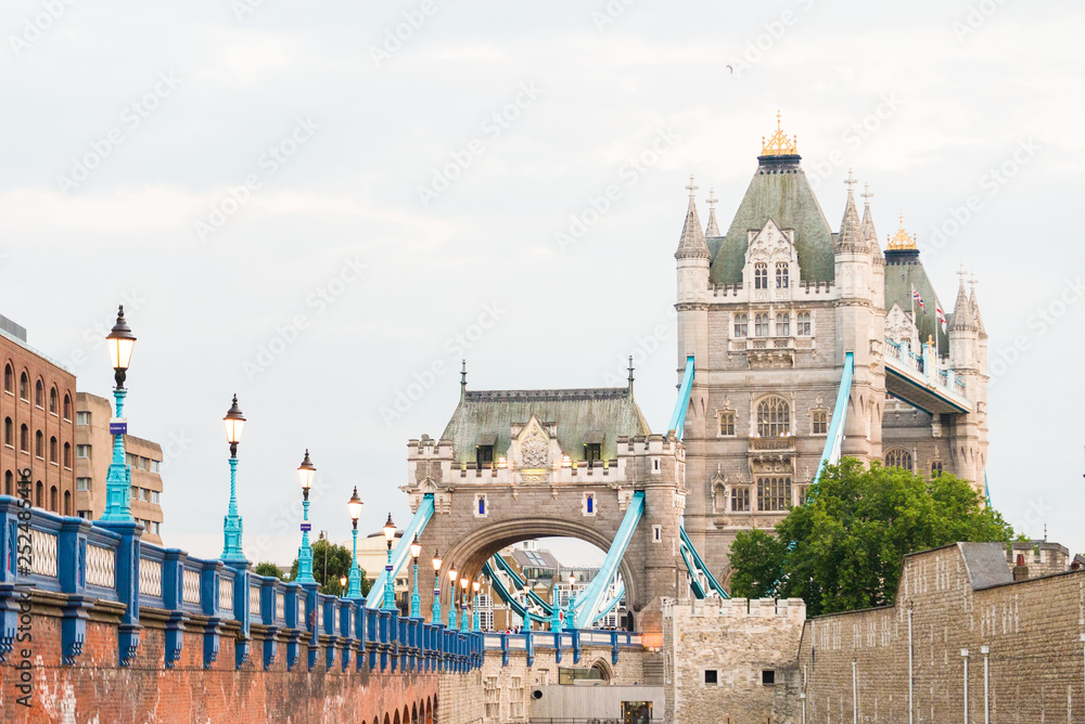 Close up of London Tower bridge from the street. Road leading to London Tower bridge. Close up of London Tower bridge from the street. Road leading to London Tower bridge.