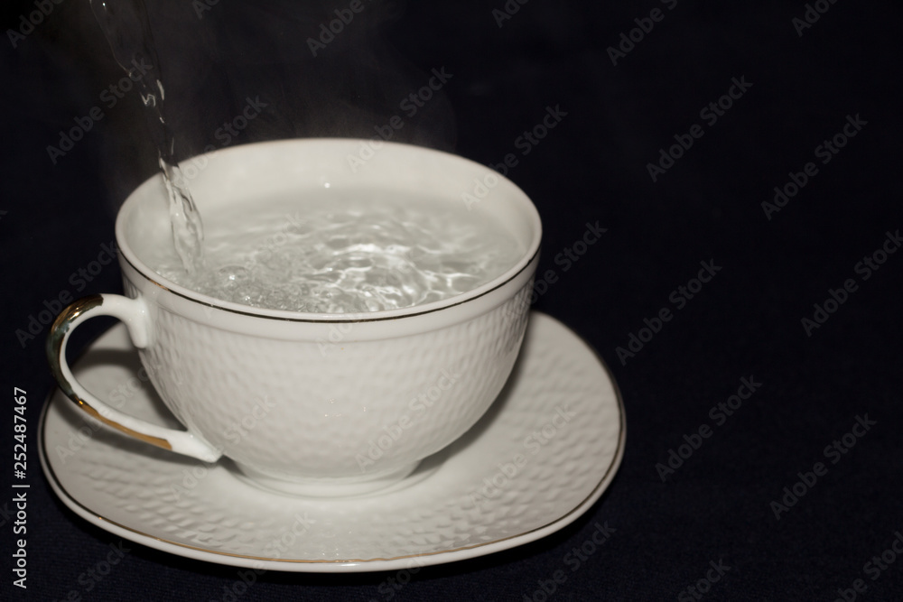 A mug of tea with lemon and chocolate. A mug of tea with lemon and chocolate.