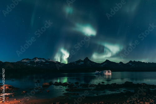 Northen light over Greenland landscape photo