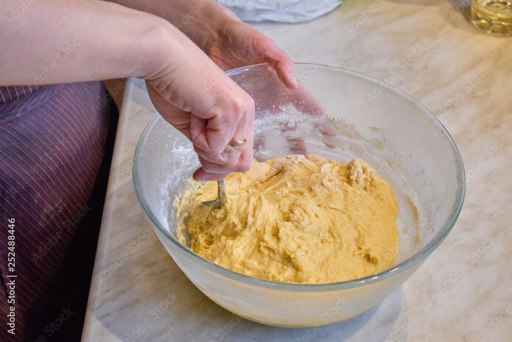 woman kneading dough in the kitchen woman kneading dough in the kitchen