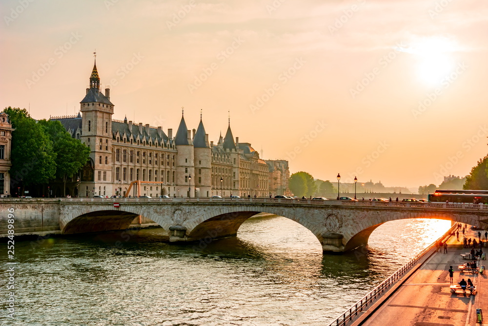Sunset over Seine river and Conciergerie palace, Paris, France