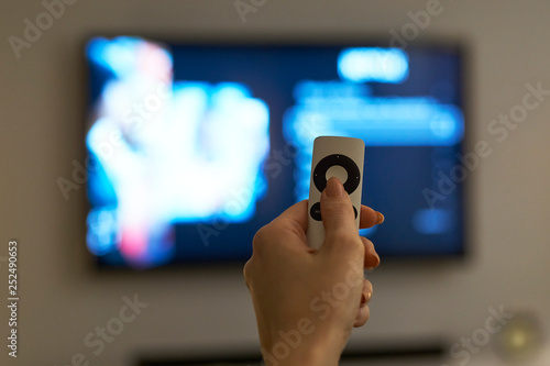 Holding hand on remote control