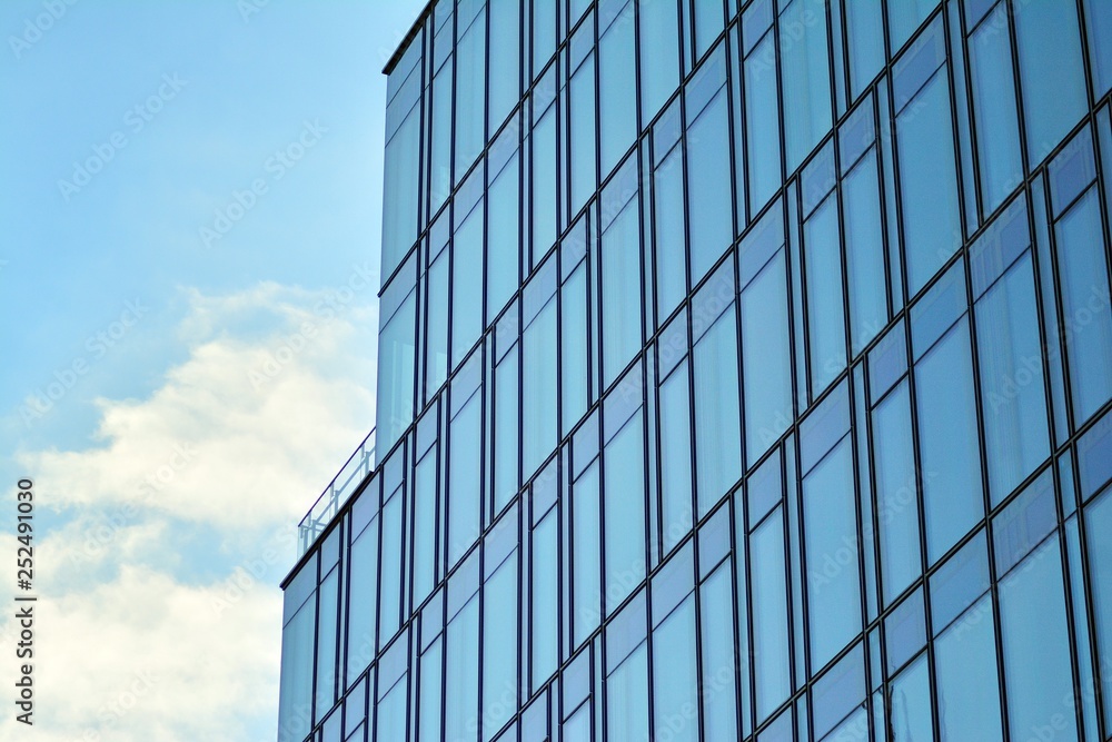 The windows of a modern building for offices. Business buildings architecture. The windows of a modern building for offices. Business buildings architecture.
