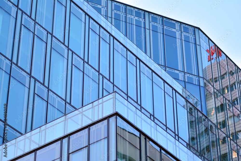 The windows of a modern building for offices. Business buildings architecture. The windows of a modern building for offices. Business buildings architecture.
