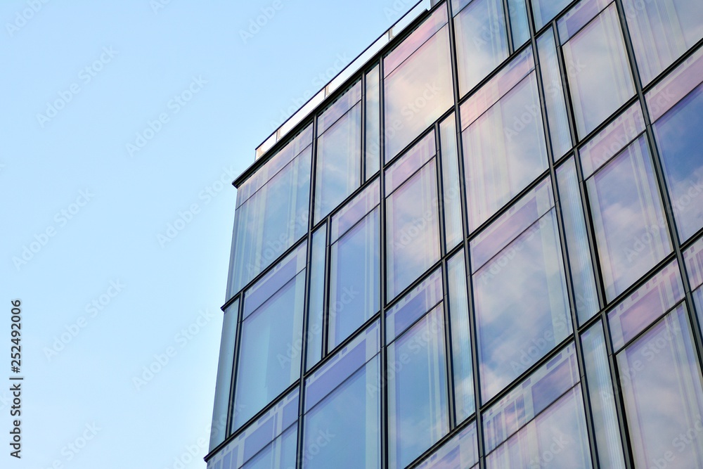 The windows of a modern building for offices. Business buildings architecture. The windows of a modern building for offices. Business buildings architecture.