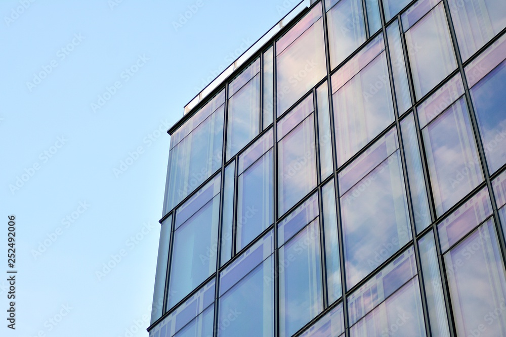 The windows of a modern building for offices. Business buildings architecture.