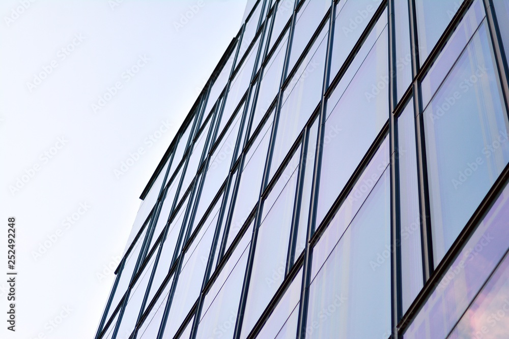 The windows of a modern building for offices. Business buildings architecture.