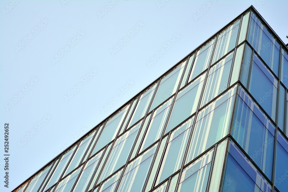 The windows of a modern building for offices. Business buildings architecture. The windows of a modern building for offices. Business buildings architecture.