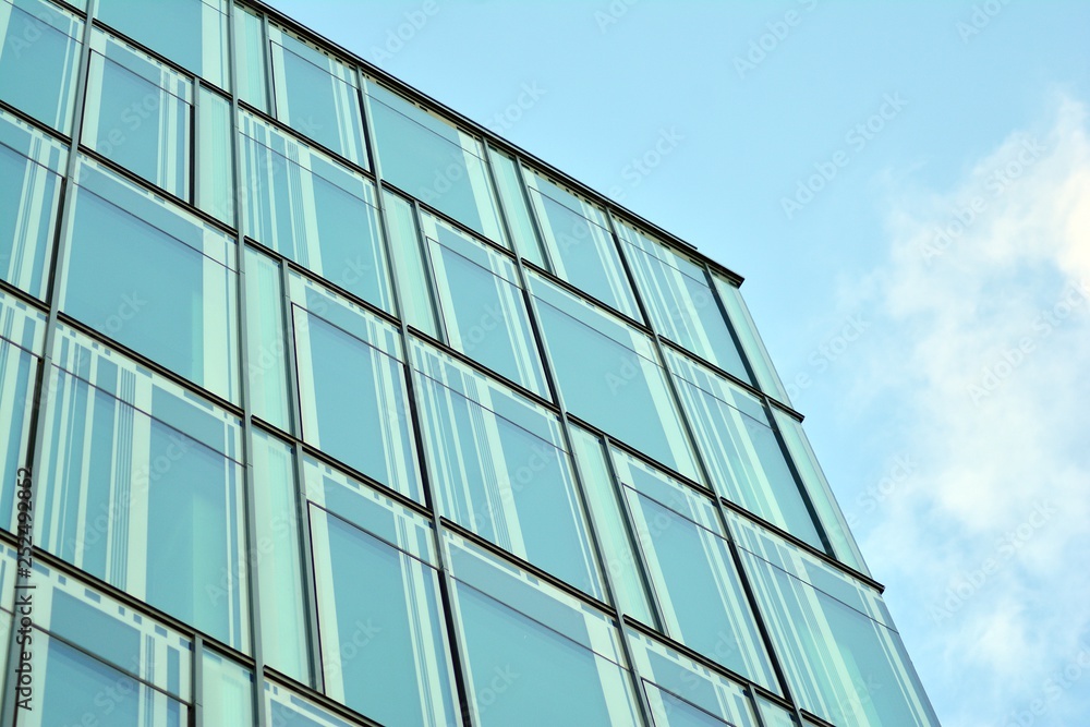 The windows of a modern building for offices. Business buildings architecture. The windows of a modern building for offices. Business buildings architecture.