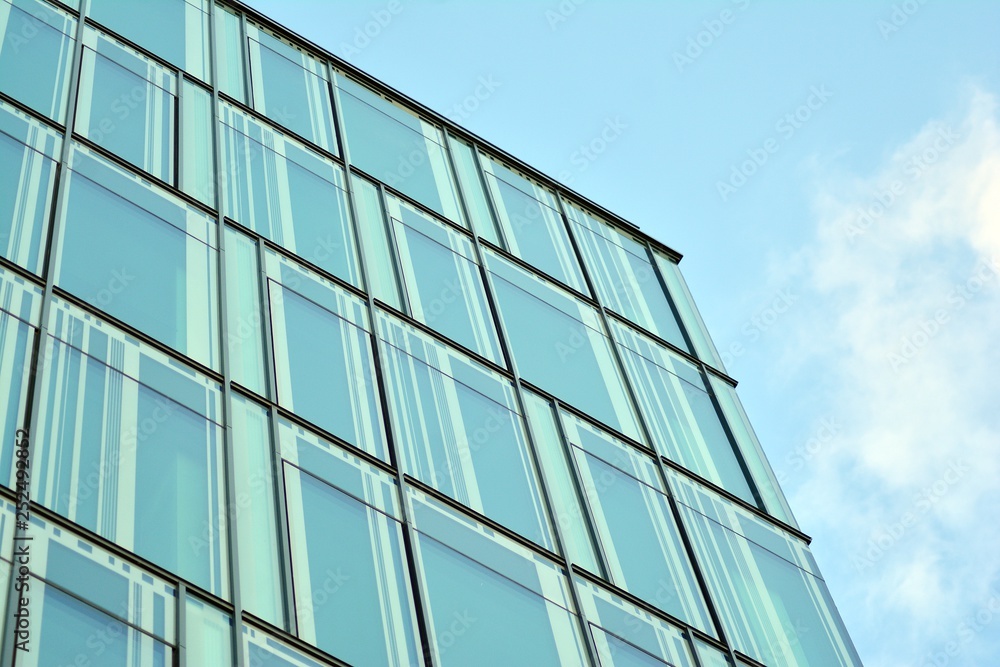 The windows of a modern building for offices. Business buildings architecture.