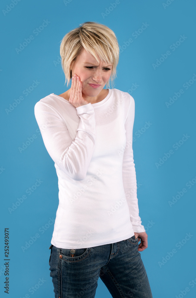 A blonde woman with a toothache.