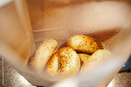 onion bagels in brown bag