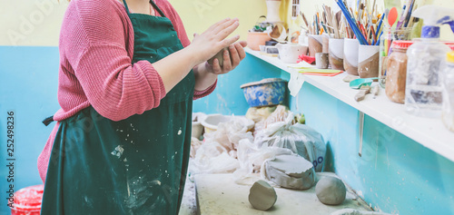 Female Pottery Artist Molding Clay