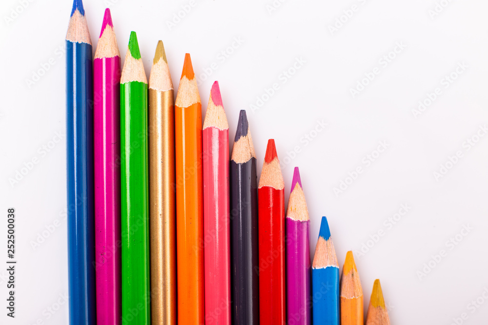 Fototapeta premium Many colorful pens in several arrangements isolated on white background