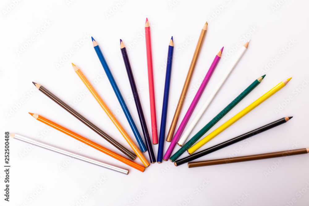 Colorful pencils pattern isolated on white background. Top view