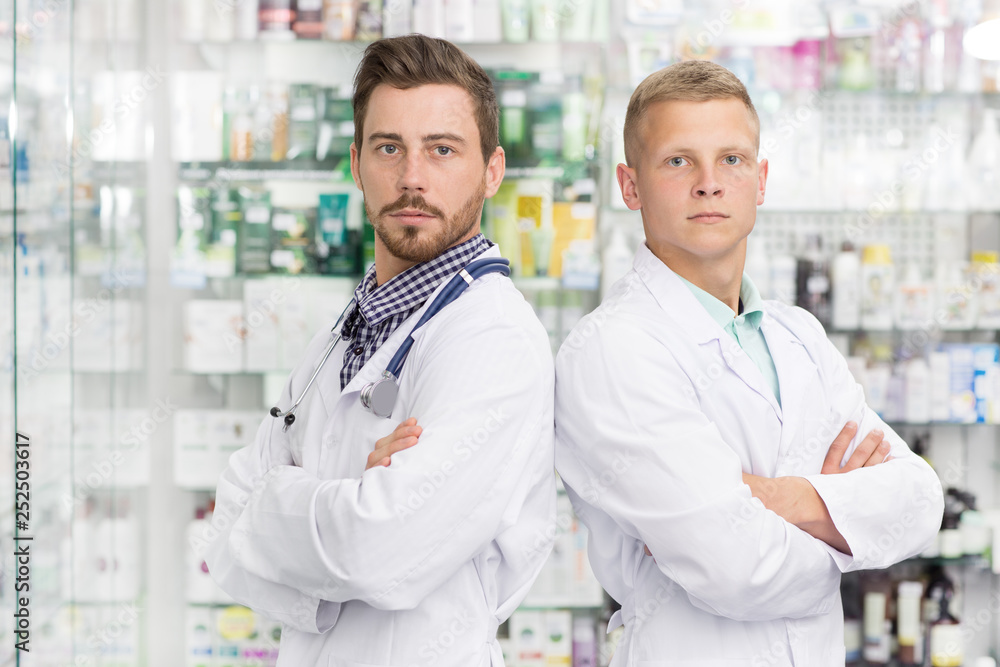Two chemists working at the pharmacy