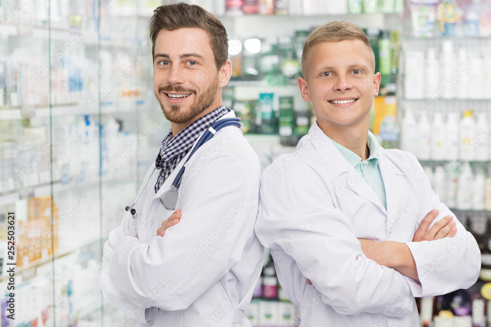 Two chemists working at the pharmacy Two chemists working at the pharmacy