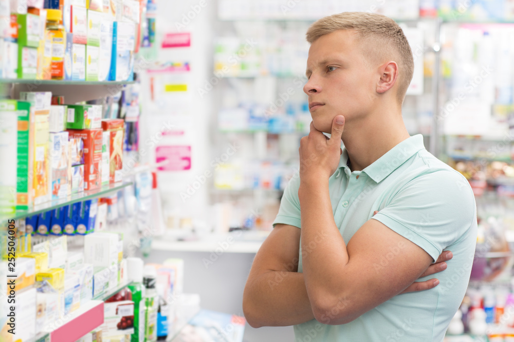 Handsome young man at the pharmacy Handsome young man at the pharmacy
