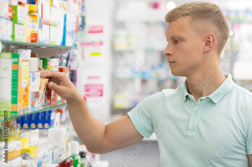Handsome young man at the pharmacy