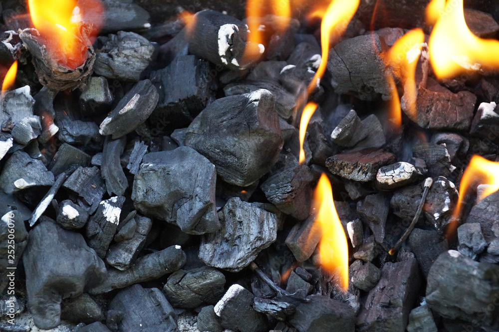 Charcoal during lighting up. Lighting fire in the grill. Charcoal during lighting up. Lighting fire in the grill.