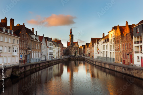 Brugge evening cityscape. Old buildings at water channel in Bruges, Belgium