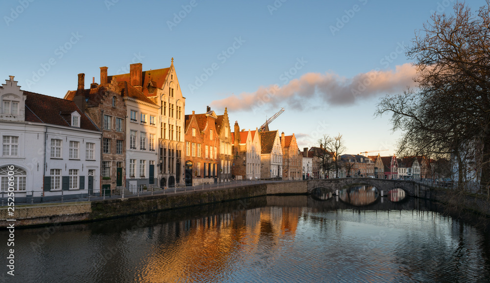 Streets of Bruges in Belgium with its medieval style facades on a cloudy day