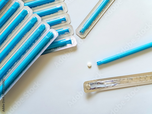 Vaginal hormone compensation medicine with applicator on a white background with copy space. Women's health concept