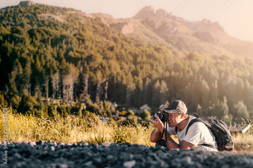 photographer taking a picture in the mountains learning lesson teach class photography course info outdoor traveler adventure explorer outdoor