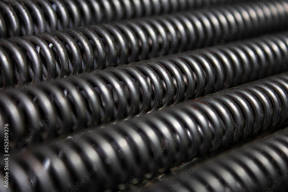 .several stretched tension iron springs .several stretched tension iron springs