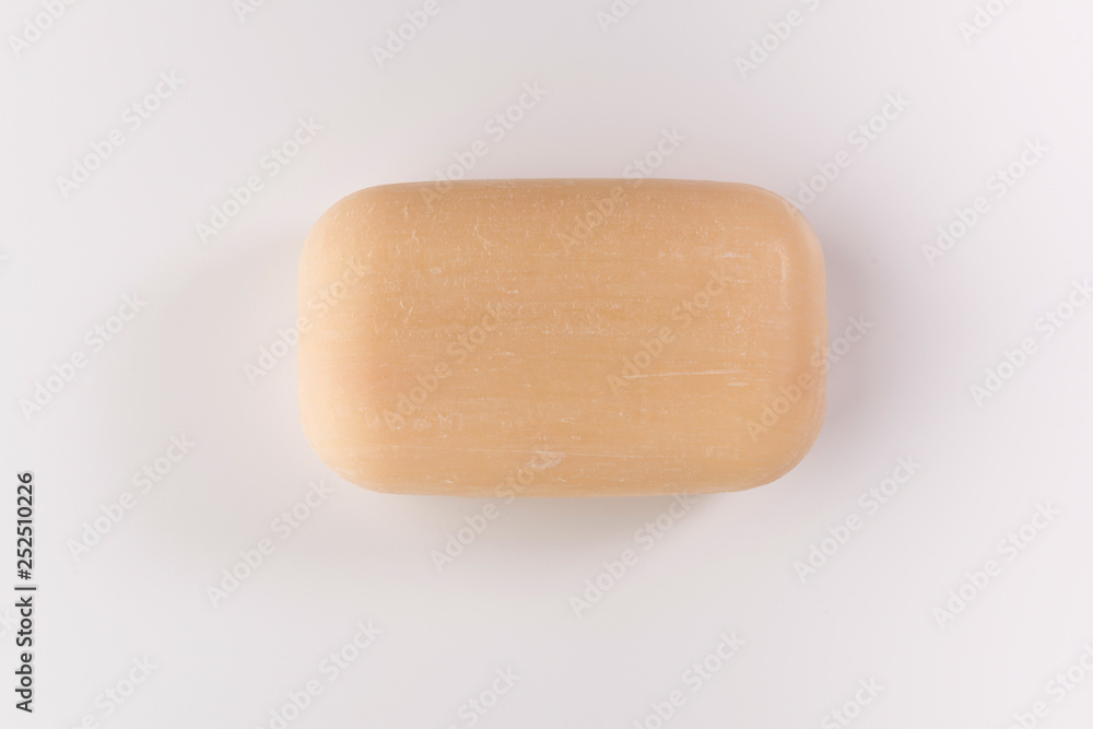 piece of beige soap isolated on a white background, top view piece of beige soap isolated on a white background, top view