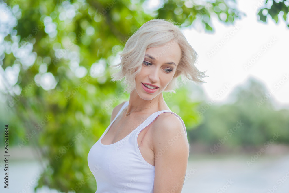 Blonde girl with natural look on the green background Blonde girl with natural look on the green background