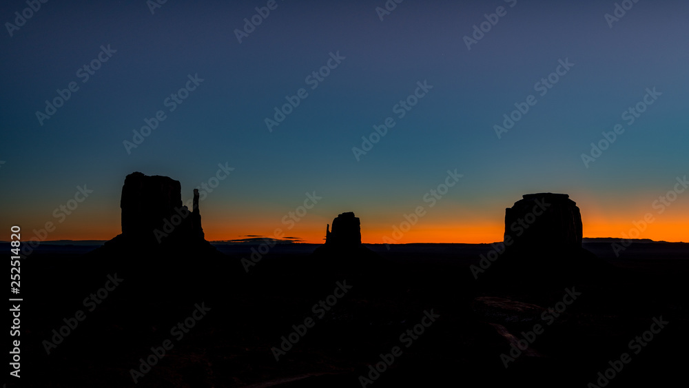 Iconic Monument valley with the Mittens sunrise silhouette