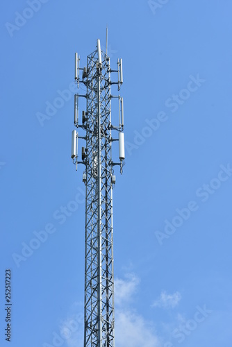 Wireless Communication Antenna With bright sky.Telecommunication tower with antennas with blue sky.