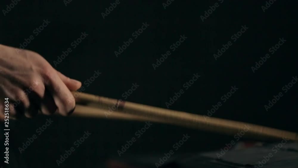 Musician's hands play on electronic pads with drumsticks Musician's hands play on electronic pads with drumsticks
