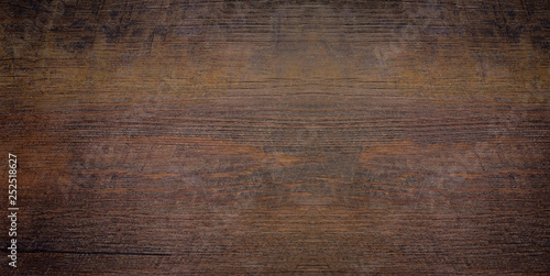 Wood texture abstract background, dark rough plank for backdrop. Old brown wooden table with crack. Surface of vintage wood board or laminate with dark natural color and pattern. photo
