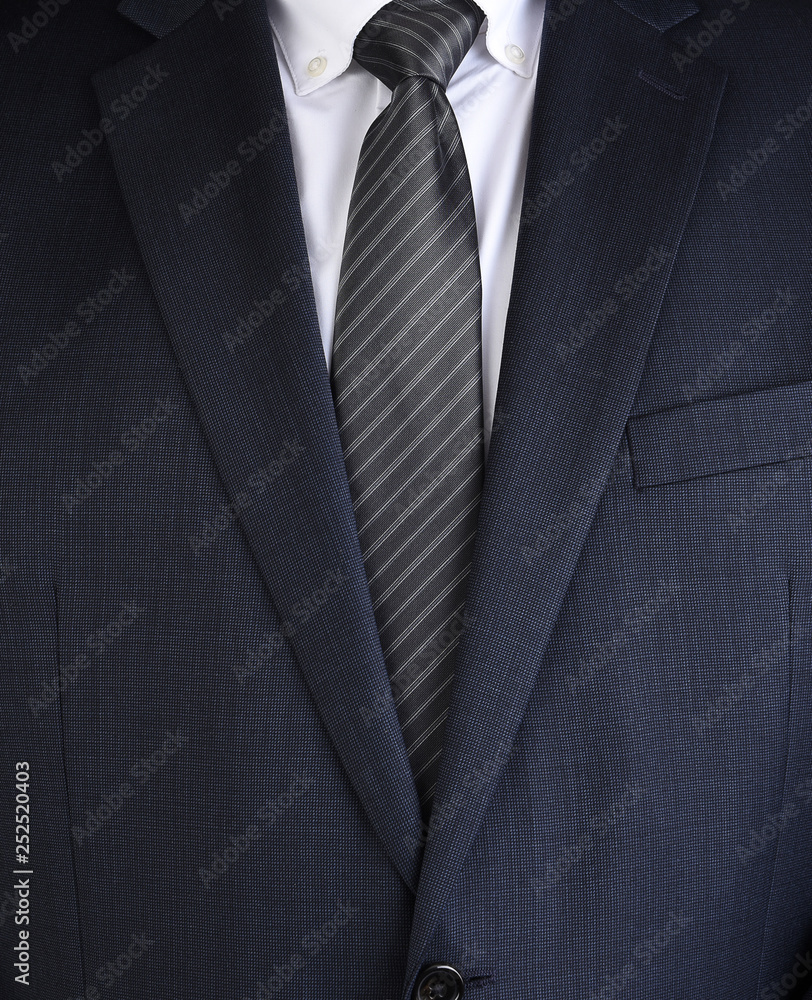 Closeup of a fashionable mens charcoal gray business suit Closeup of a fashionable mens charcoal gray business suit